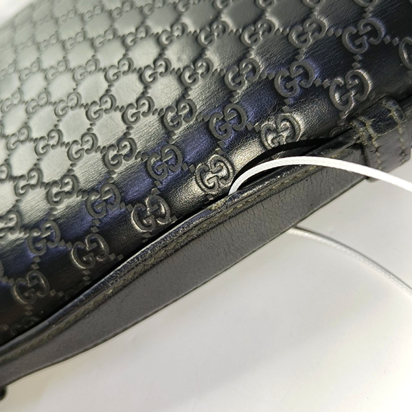 Authenticated pre-owned  Microguccissima Monogram Calfskin Black - Clutch at Looply