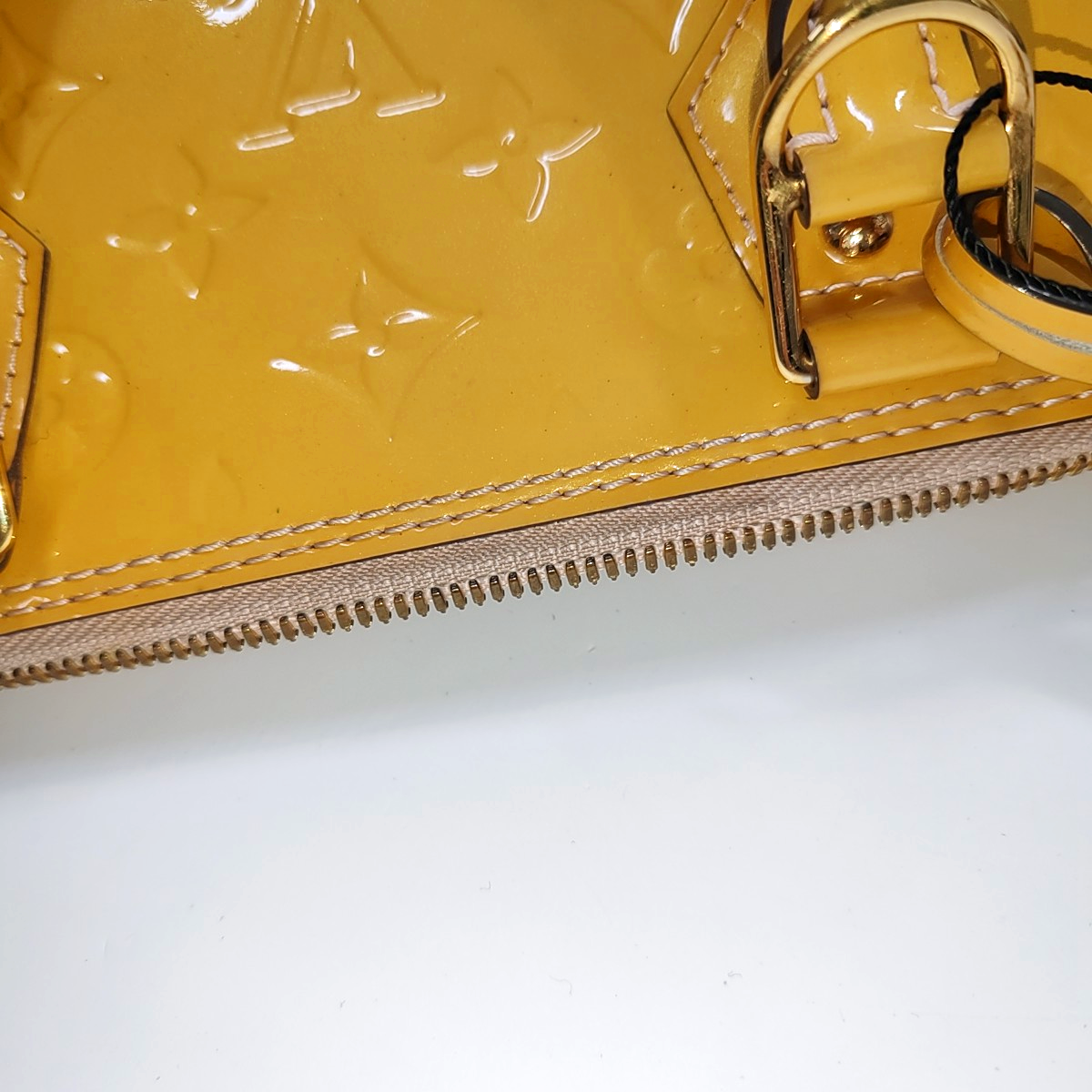 Authenticated pre-owned  Alma PM Patent Leather Yellow - Top Handle Bag at Looply