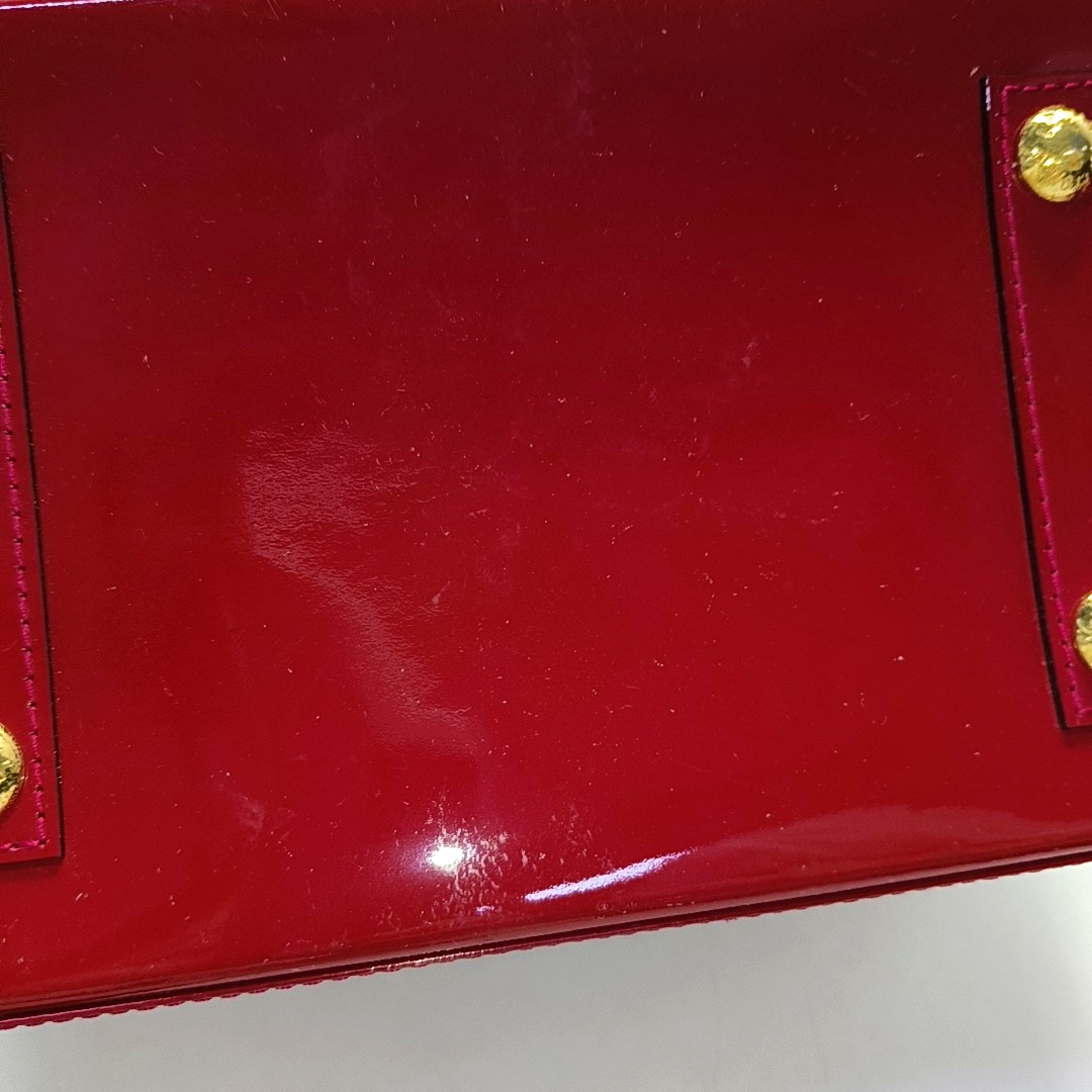 Authenticated pre-owned  Alma PM Monogram Calfskin Red - Top Handle Bag at Looply