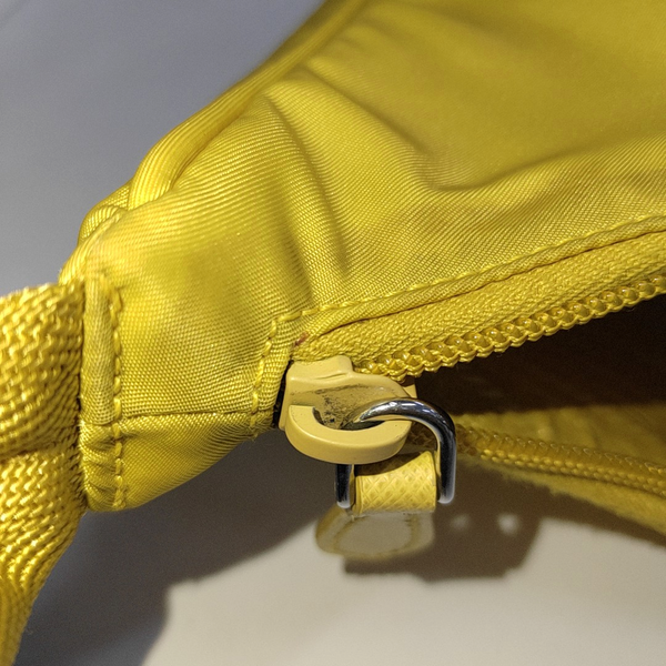 Authenticated pre-owned  Re-Edition2000 Mini Nylon Yellow - Top Handle Bag at Looply