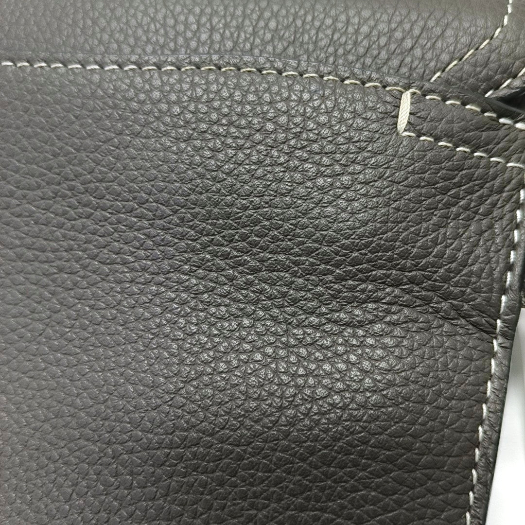Authenticated pre-owned  Saddle Leather Gray - Clutch at Looply