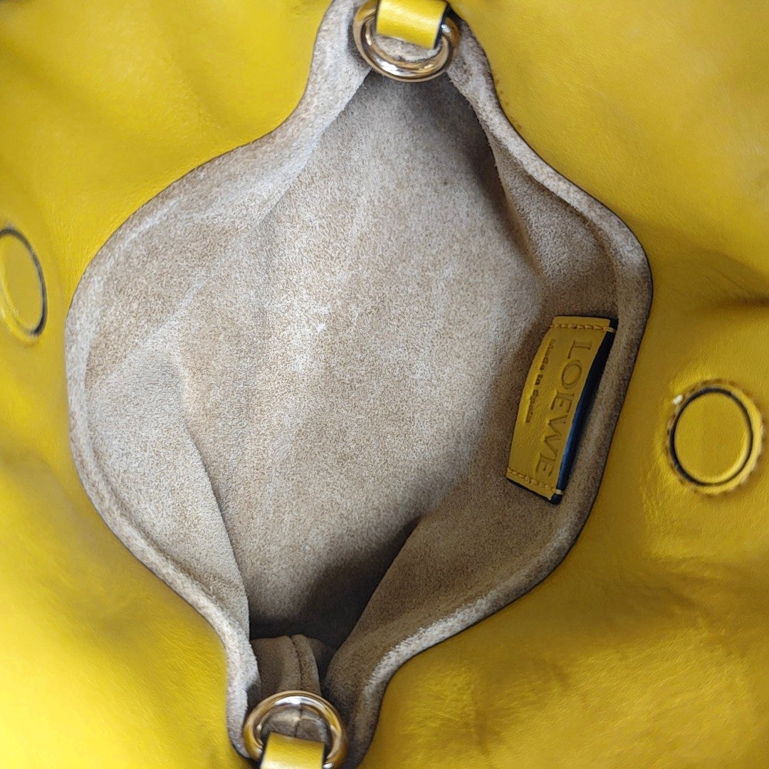 Authenticated pre-owned  Flamenco Calfskin Yellow - Clutch at Looply
