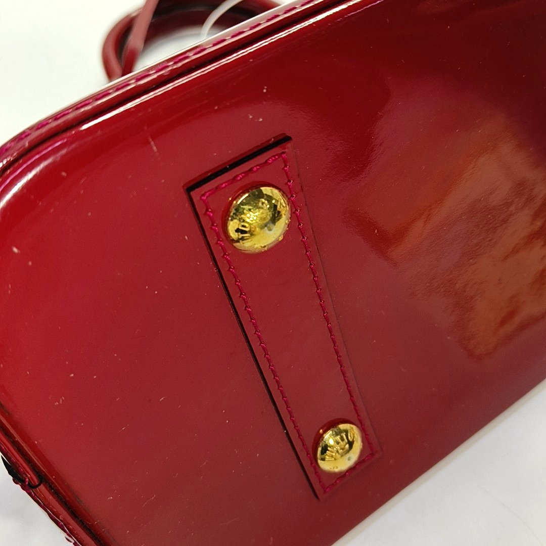 Authenticated pre-owned  Alma PM Monogram Calfskin Red - Top Handle Bag at Looply