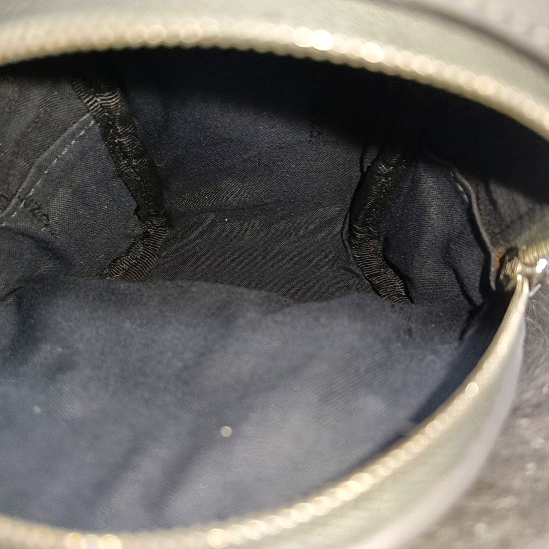 Authenticated pre-owned  Monster Calfskin Gray - Clutch at Looply
