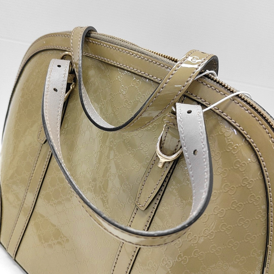 Authenticated pre-owned  Microguccissima Monogram Patent Leather Green - Top Handle Bag at Looply