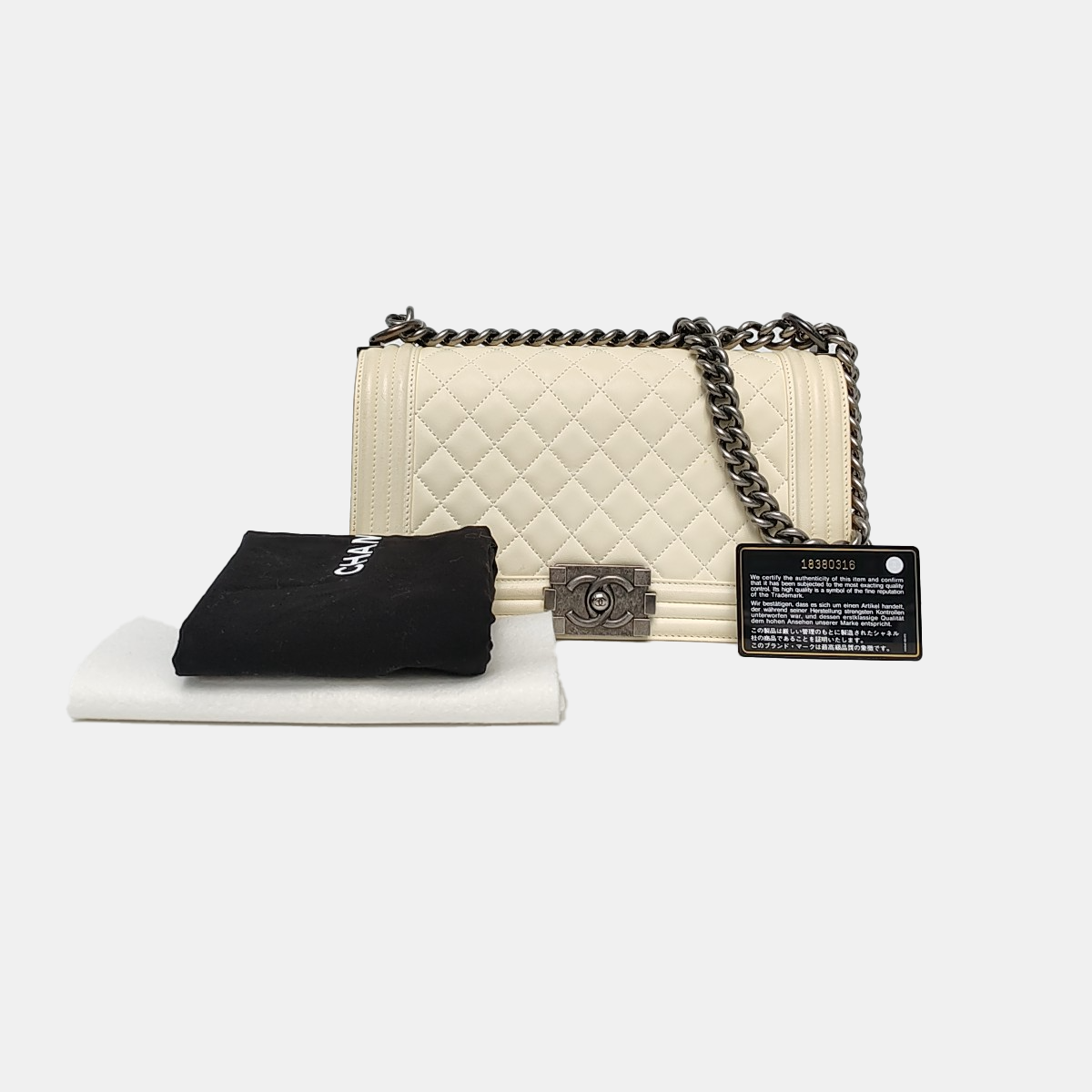 Authenticated pre-owned  Boy Chanel Medium Quilted Lambskin White - Crossbody Bag at Looply