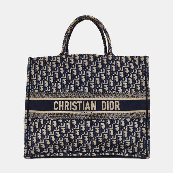 Authenticated pre-owned  Book Tote Large Monogram Canvas Blue - Top Handle Bag at Looply