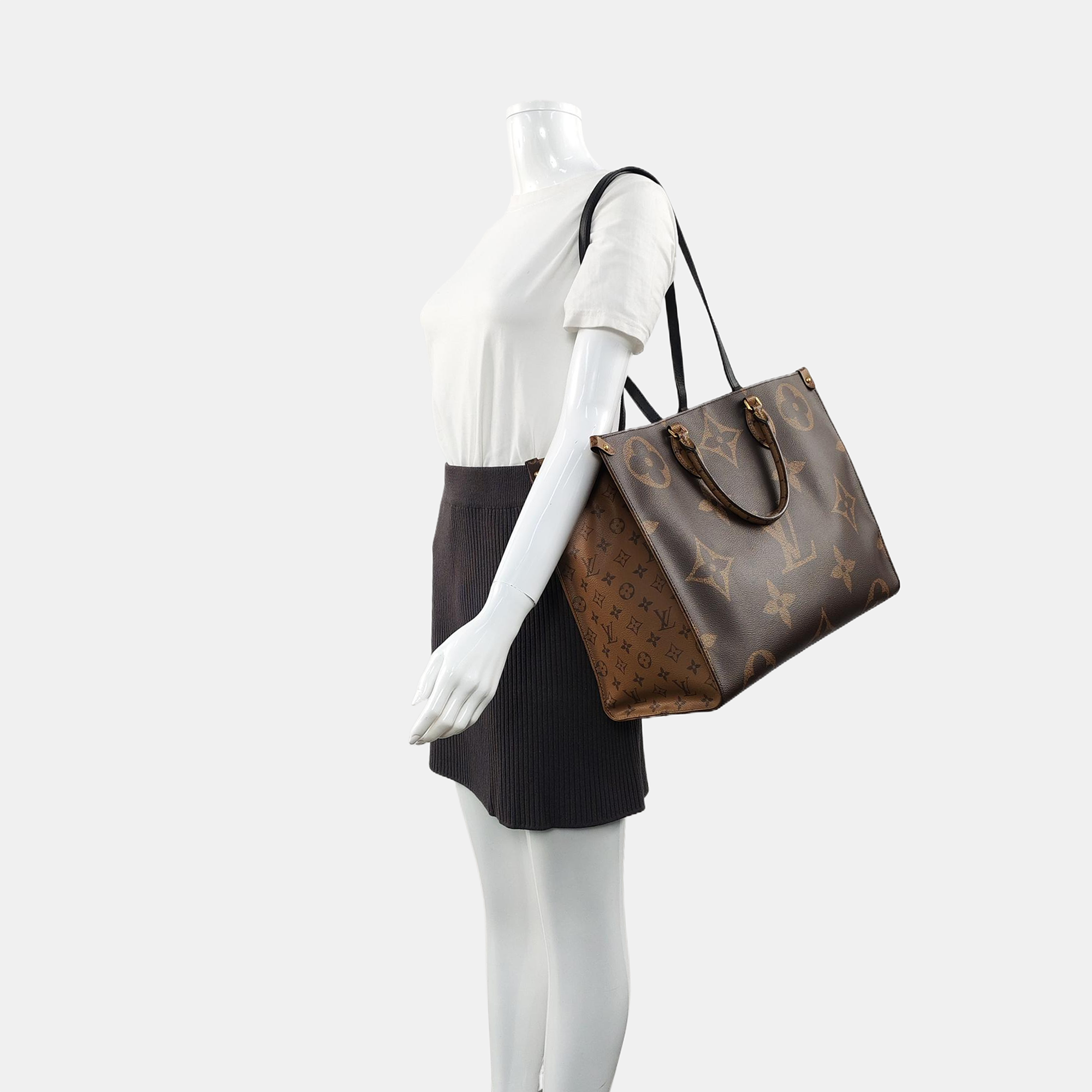 Authenticated pre-owned  Onthego GM Monogram Coated Canvas Brown - Shoulder Bag at Looply