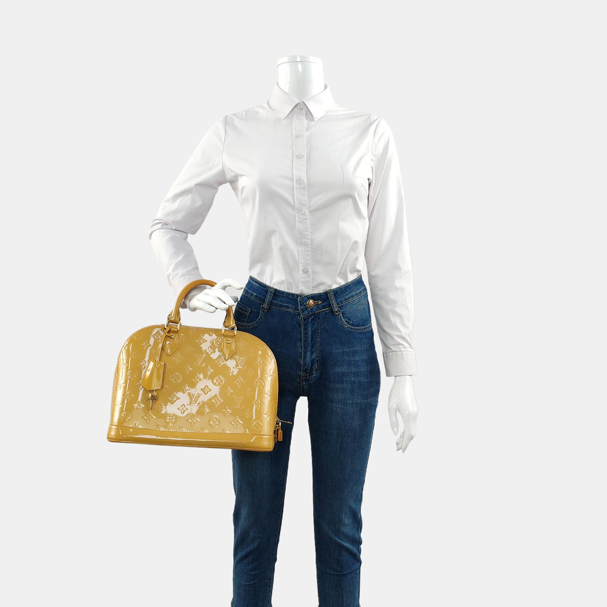 Authenticated pre-owned  Alma PM Monogram Patent Leather Yellow - Top Handle Bag at Looply