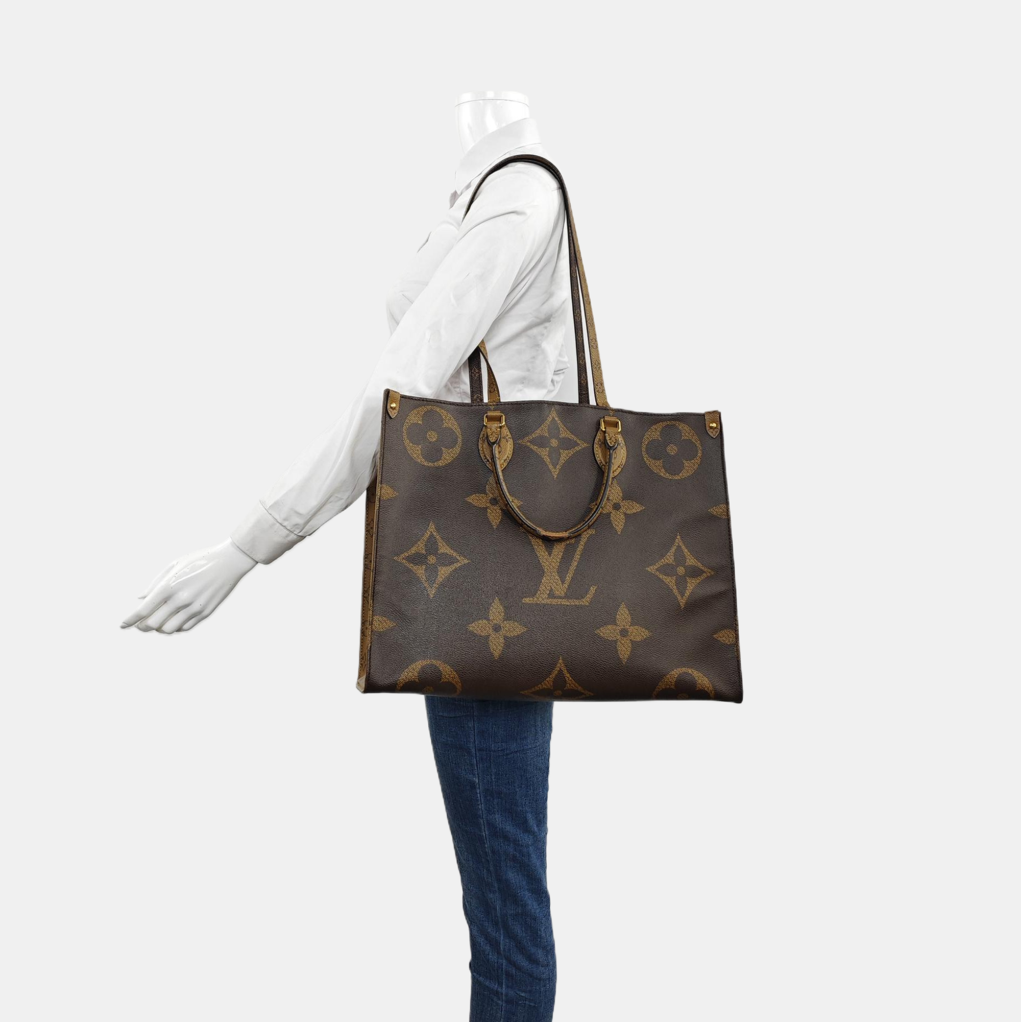Authenticated pre-owned  Onthego GM Monogram Coated Canvas Brown - Shoulder Bag at Looply